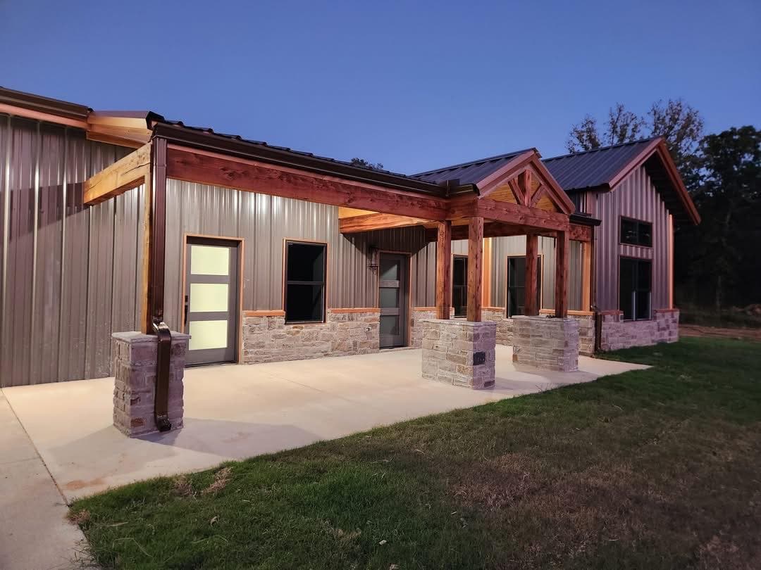 Barndominium exterior at sunset